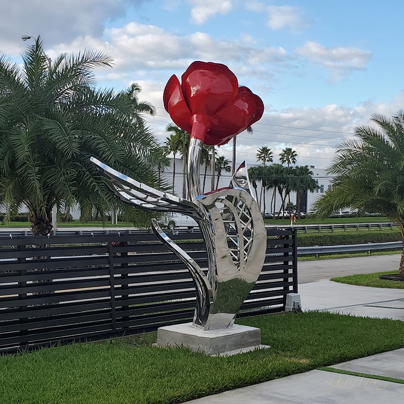 Large stainless steel rose sculpture on the lawn