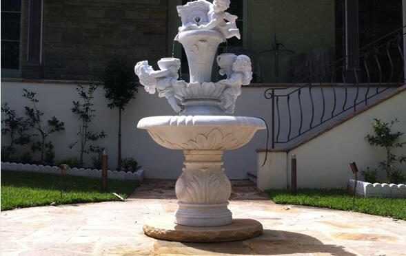 marble fountain with child statues