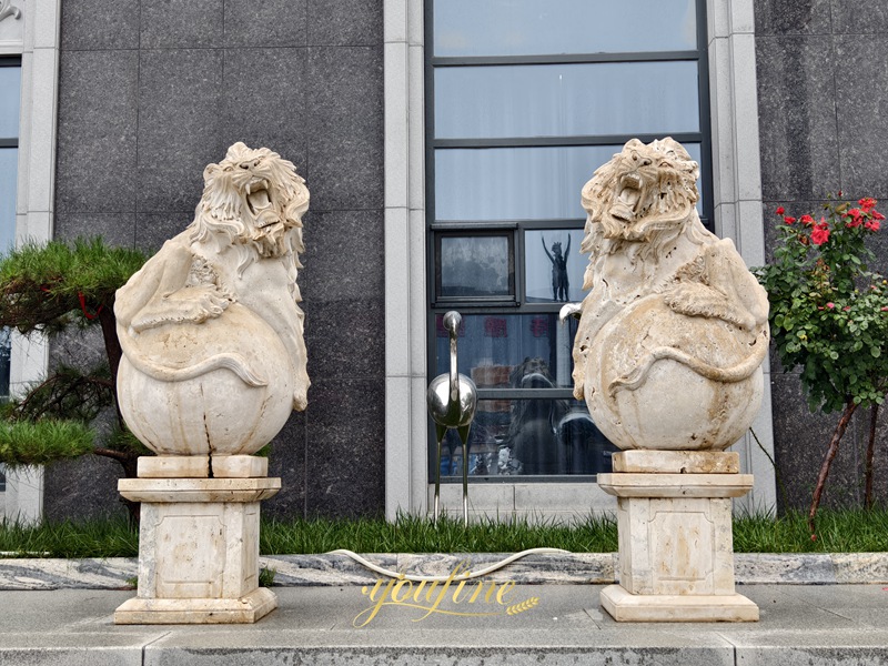 lion statue on ball