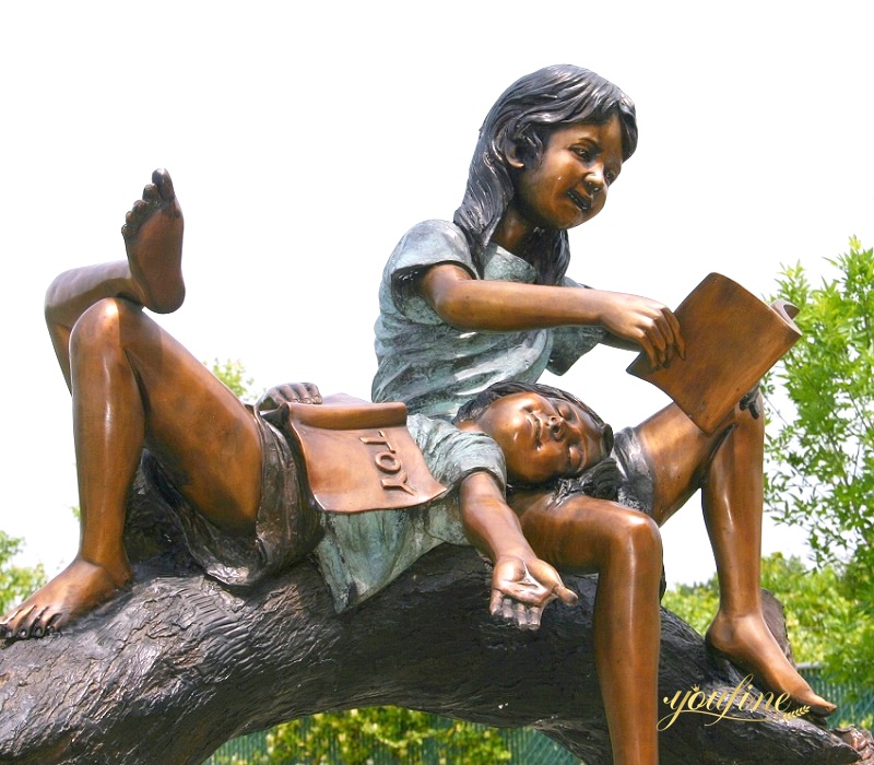 Boy and Girl Reading on Tree Branch sculpture art