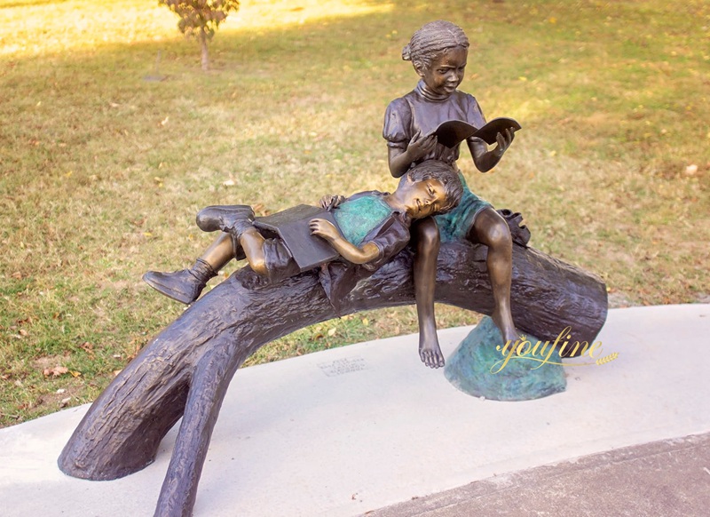 Boy and Girl Reading on Tree Branch sculpture