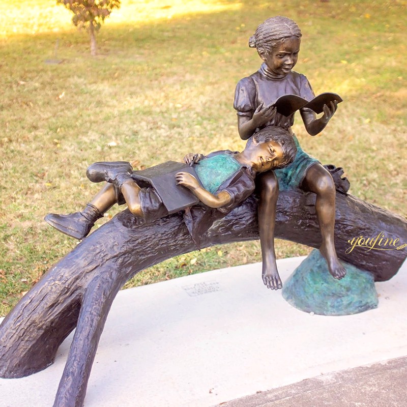 garden statue girl reading book