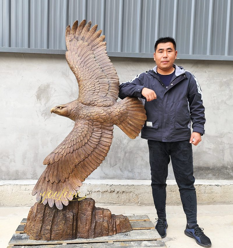 Vertical Flying Eagle Statue with artist