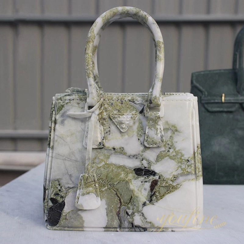 Ceramic]⁠Corinne Marchetti's Ceramic bag directly inspired by the Bottega  Veneta padded cassette bag has been created exclusively for Objet  d'Emotion. A humorous take on an iconic accessory, worn by fashionistas  around the