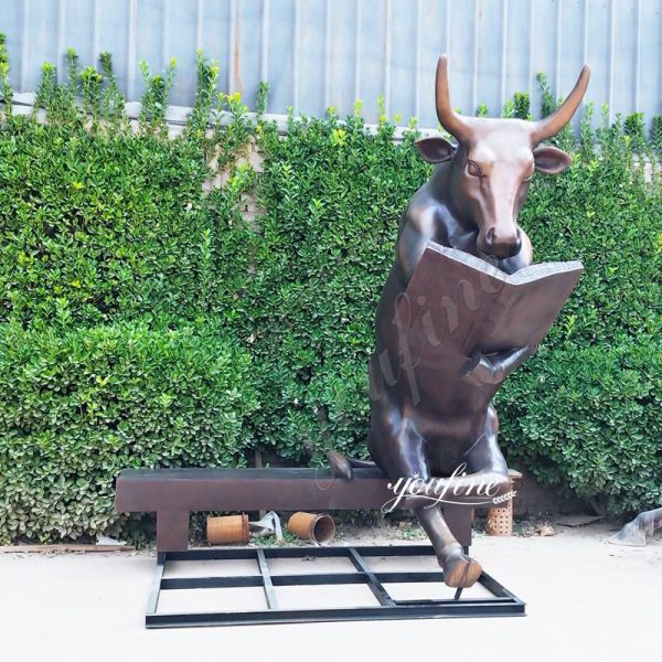 bronze bull reading statue