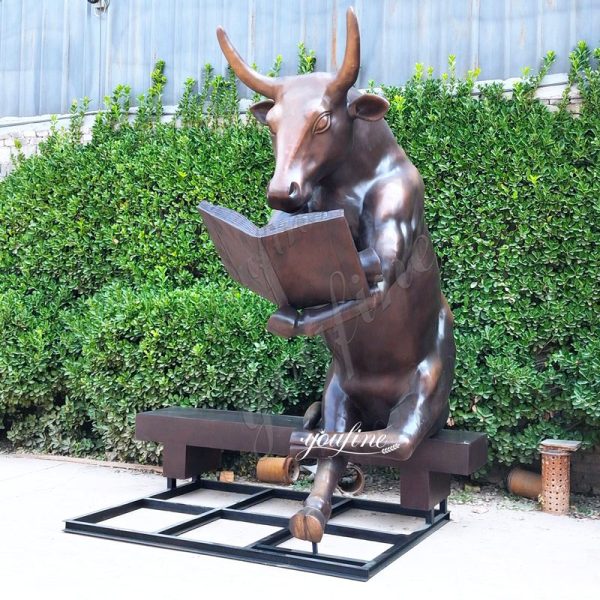 large bronze bull reading statue