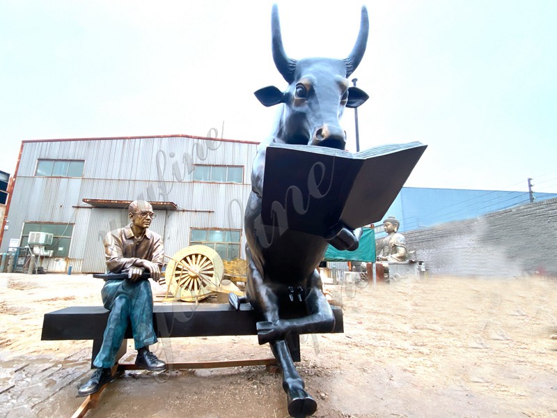 large bull reading statue