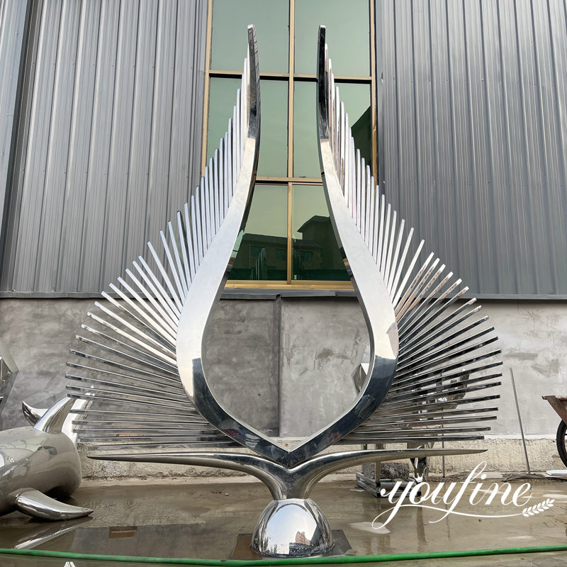 large mirror polished stainless steel wing sculpture