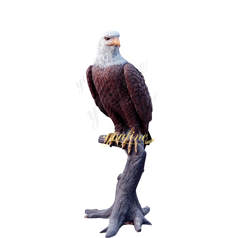 Eagle sculpture standing on a tree trunk