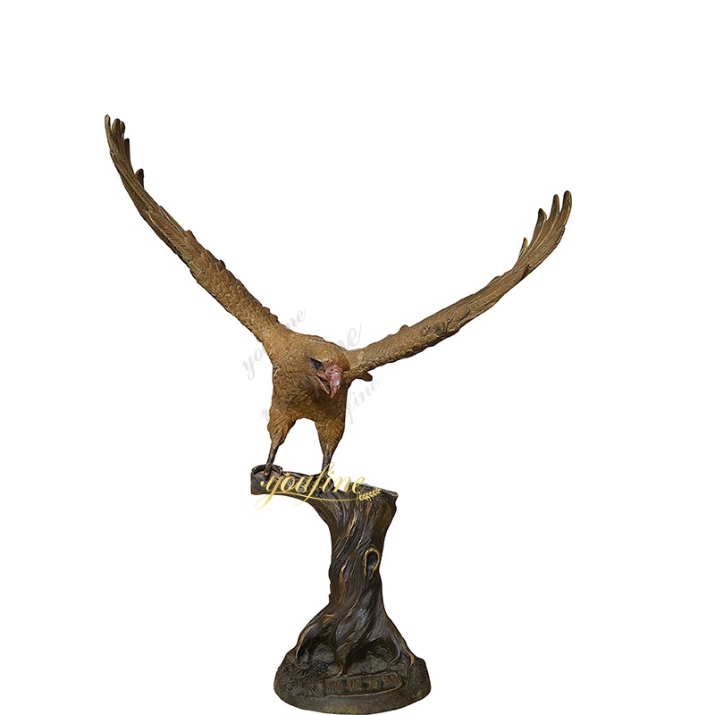 Sculpture of a flying eagle standing on a tree trunk