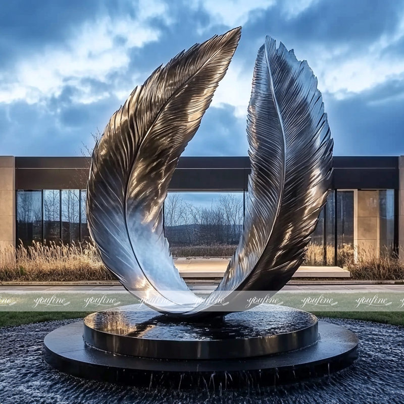 metal art falling feathers sculpture