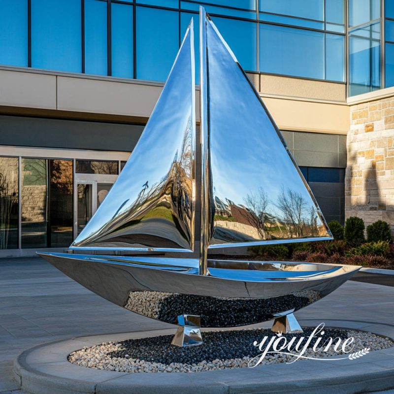 mirror polished metal sailboat sculpture